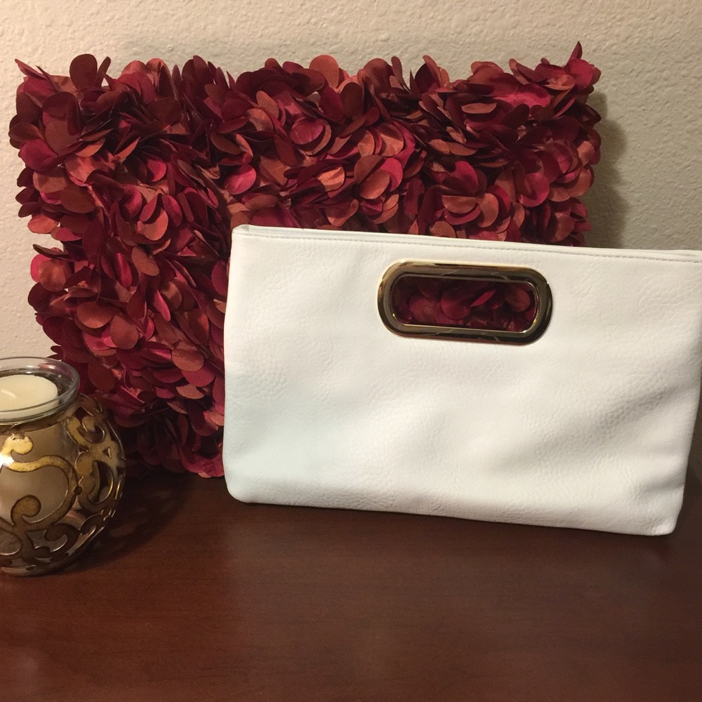 Ivory clutch purse, with gold strap.