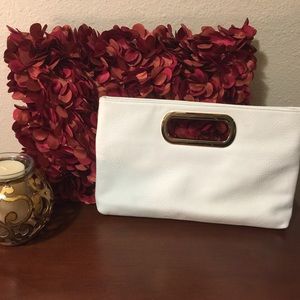 Ivory clutch purse, with gold strap.
