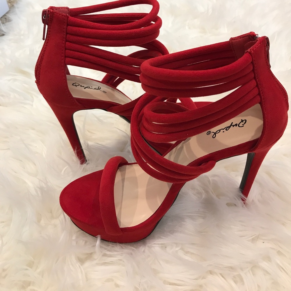 One pair of red Qupid heels 👠