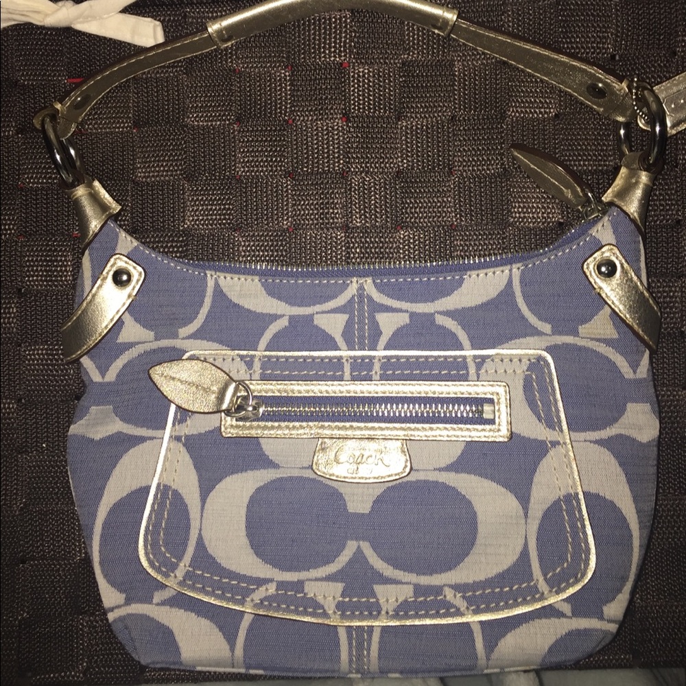 coach jean and gold handbag