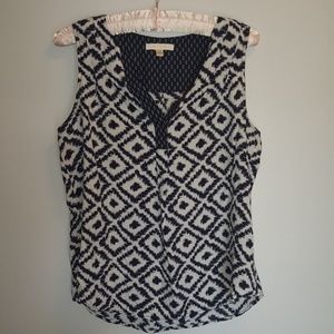 Navy and white sleeveless blouse