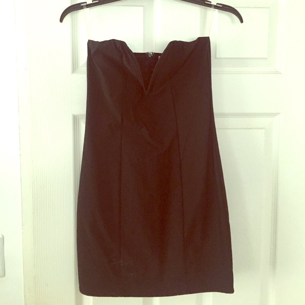 Black form fitting going out dress with v-neck top