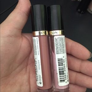 Two revlon lipgloss's, never used .