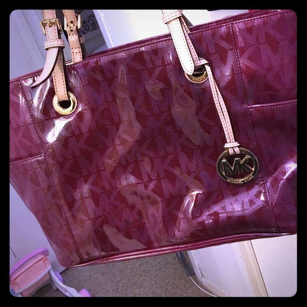 Burgundy, tan, gold Michael Kors tote bag