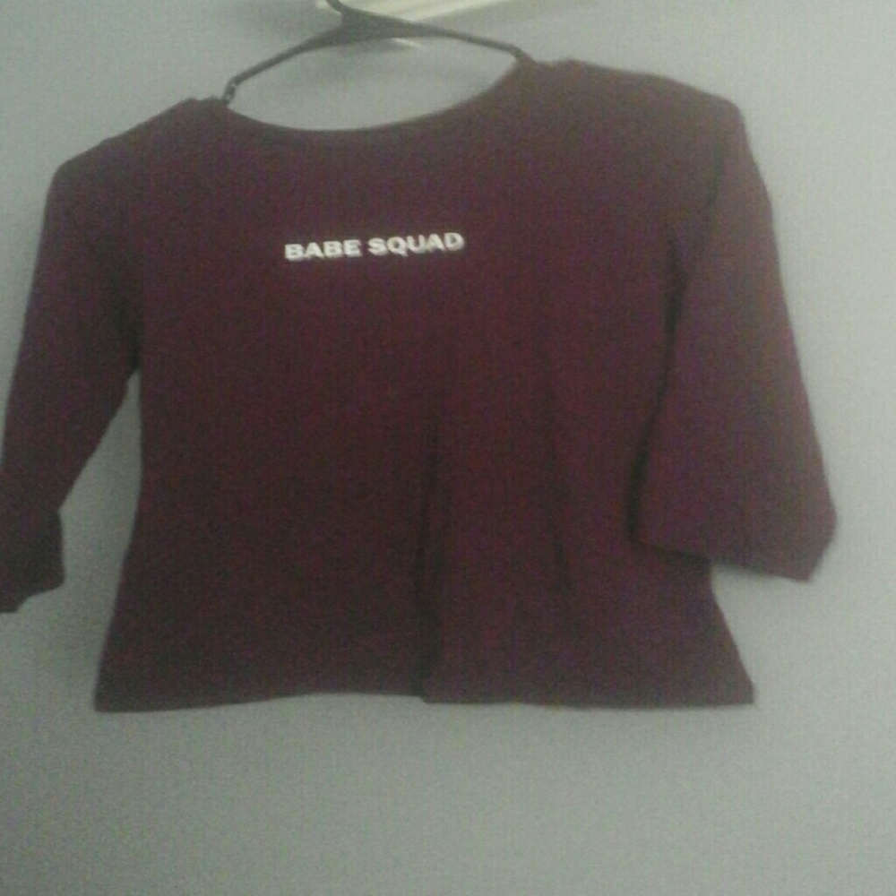 This is a half-sleeved shirt with a slight crop