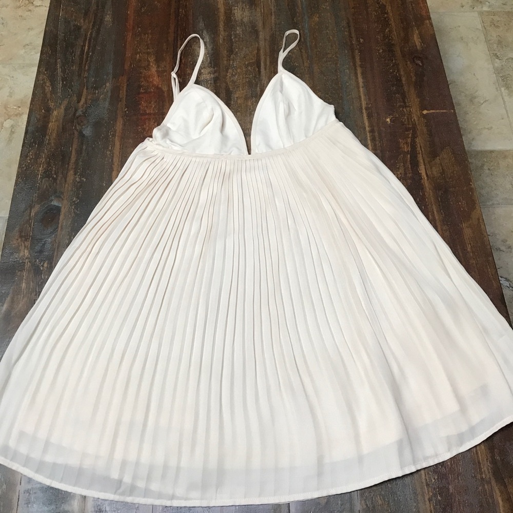 Cream party dress. Never worn.