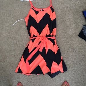 Neon coral and navy chevron romper