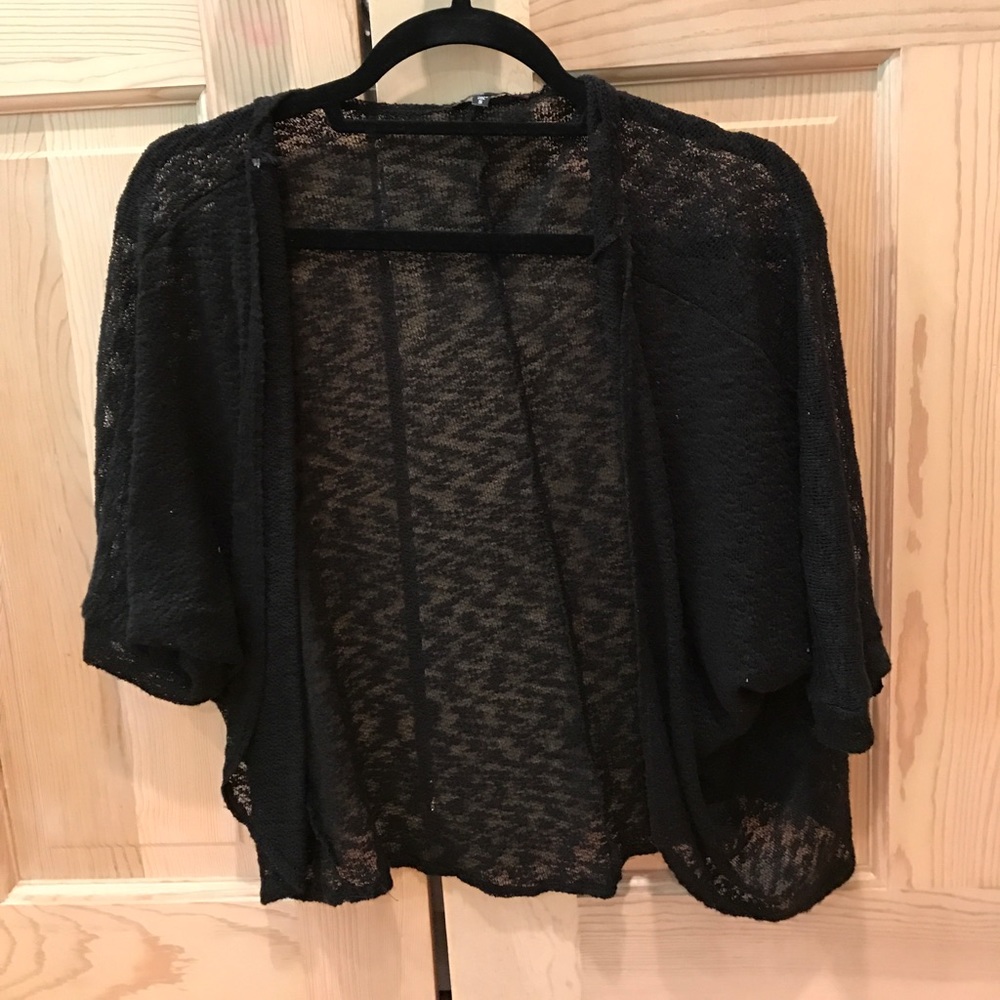 Black three-quarter length sleeve shawl.
