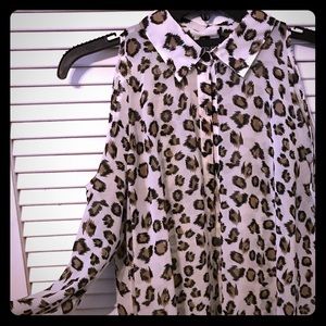 Cold shoulder button-up in a fierce animal print