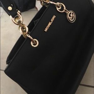 Black and gold Michael Kors purse