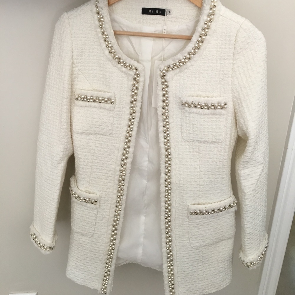 Long tweed pearl embellished jacket.
