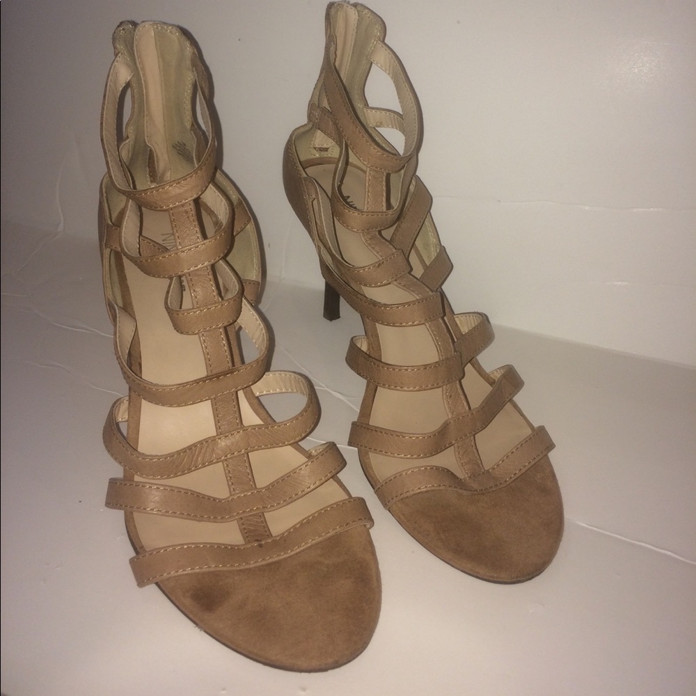 Tan strap 3" high heel shoes.