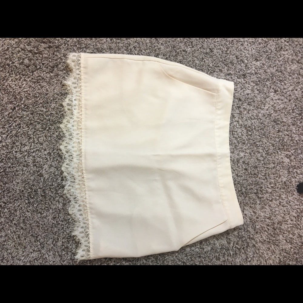 Cream lace mini skirt with pockets size small