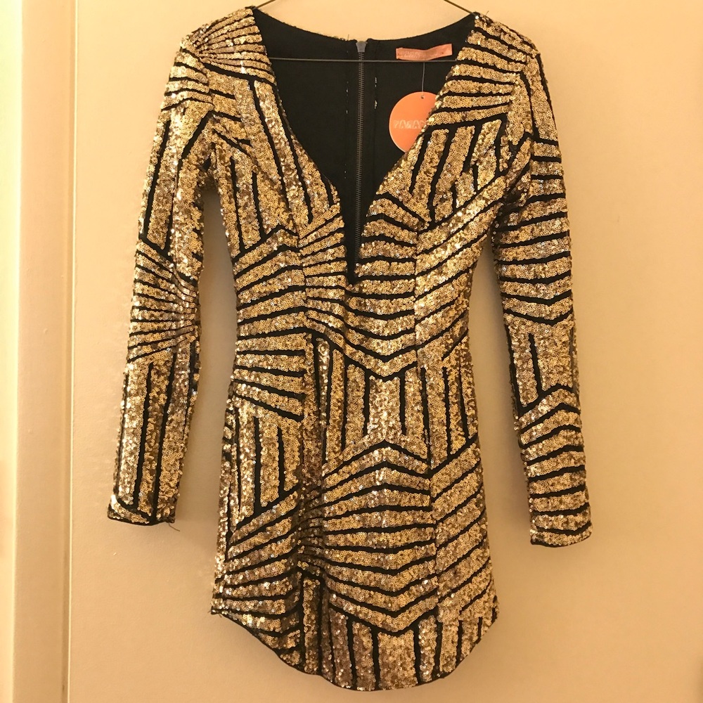 Long sleeve black and gold sequined bodycon dress