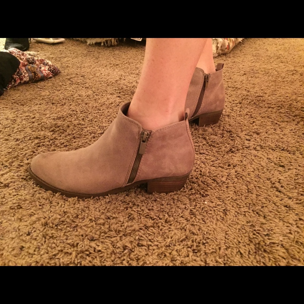Tan Carlos Santana booties never worn