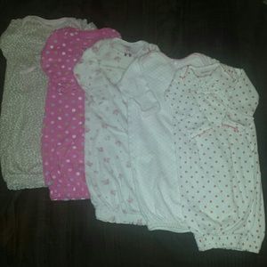 Five baby gowns
