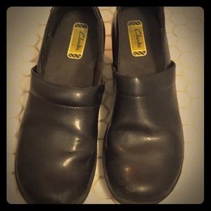 Black Clarks leather clogs
