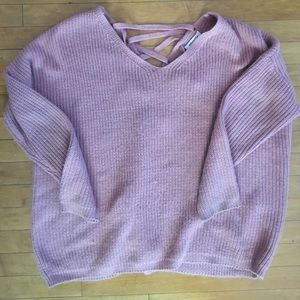 Pink knit sweater with laced up back