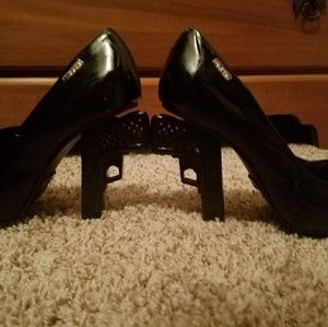 Black paten leather pistol heels