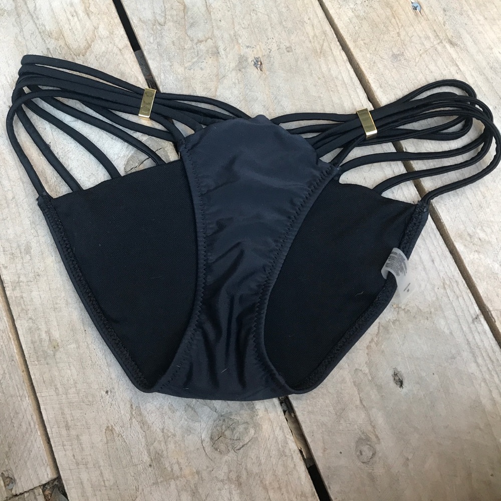 Black string bikini bottoms, never worn.