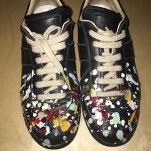 Masion Margiela paint splatter sneakers.