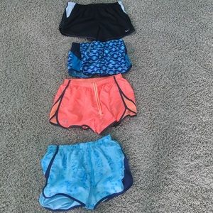 4 pairs of nike and under armor shorts