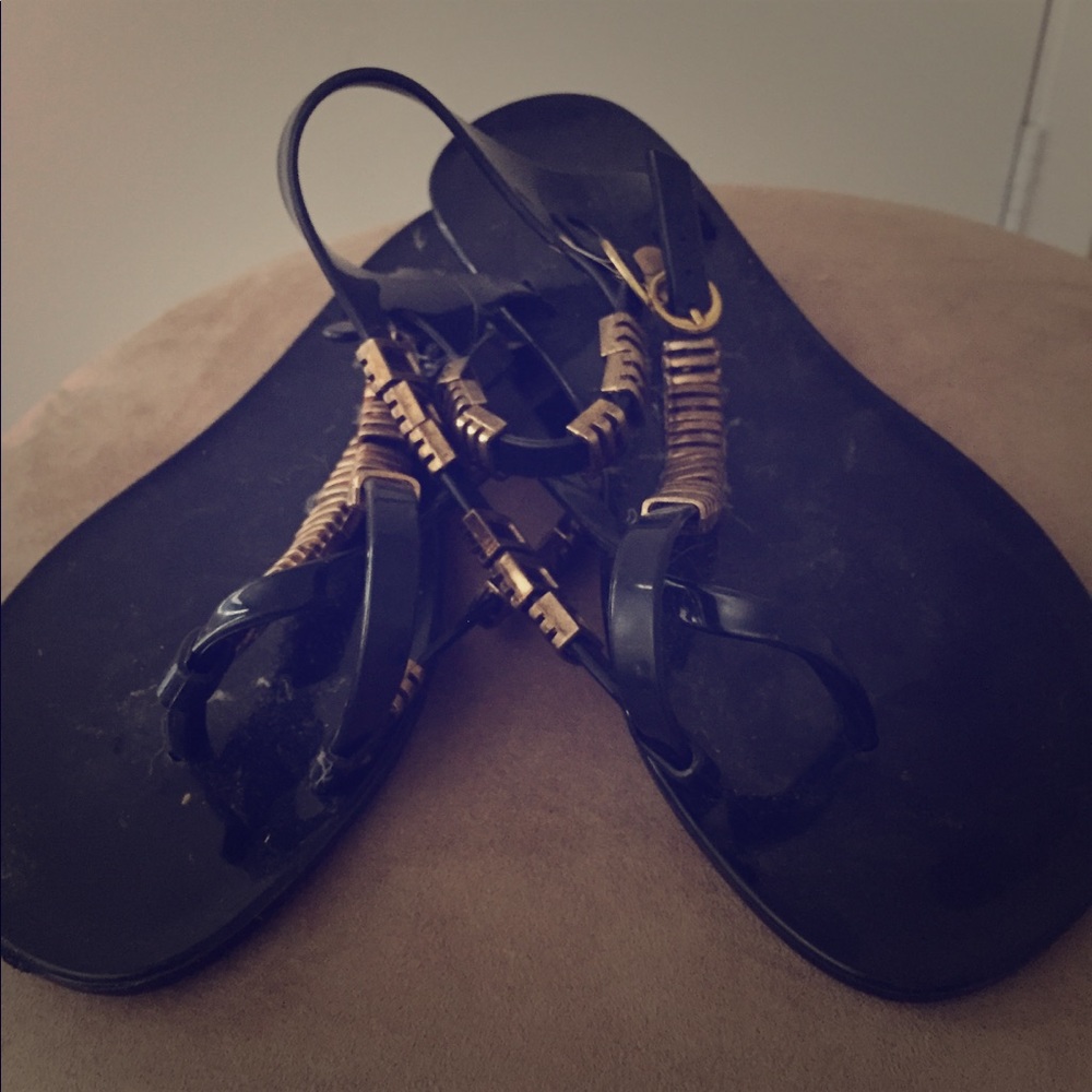 Black jellies with gold accents