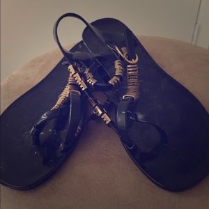 Black jellies with gold accents