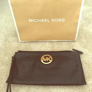 Authentic Michael Kors clutch.