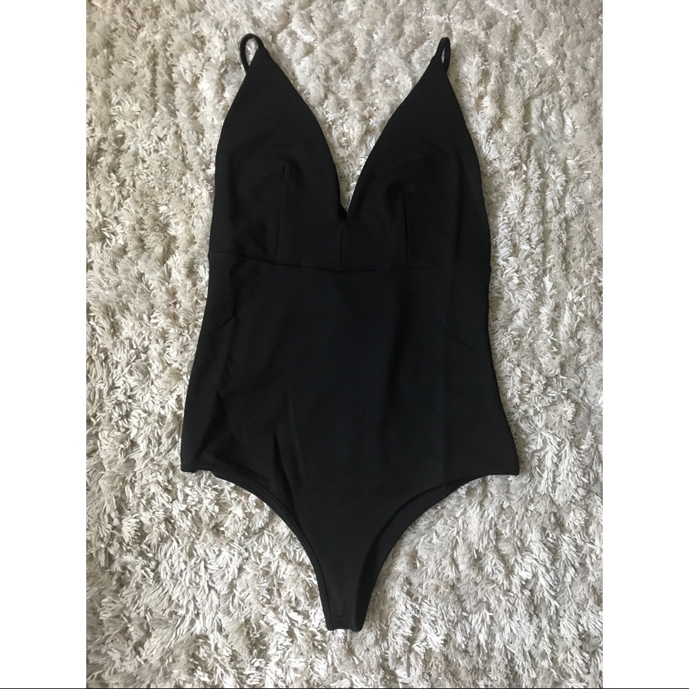 Deep v bodysuit in black.