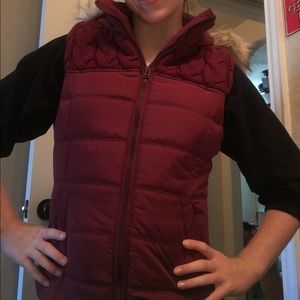 Maroon zip up vest with furry hood
