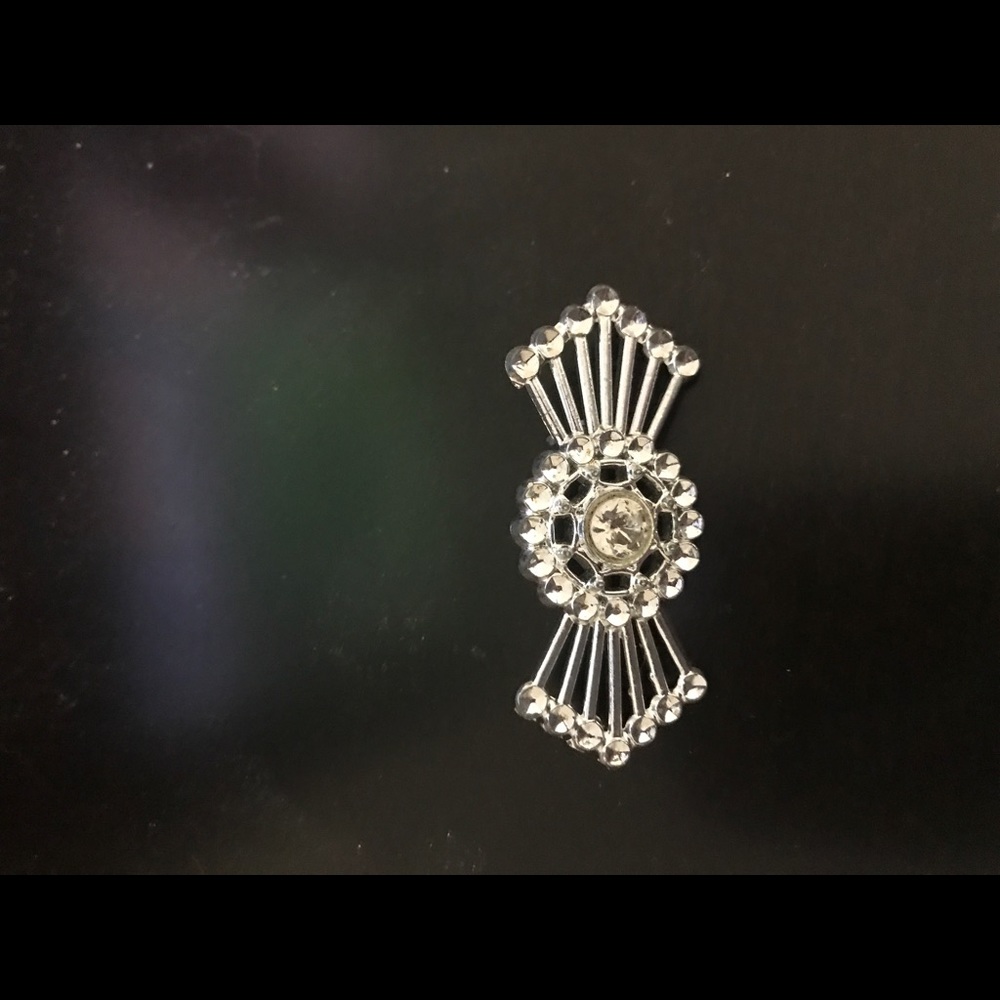 Silver in color brooch. This is a beautiful piece