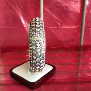 Silver toned crystal hard bangle bracelet.