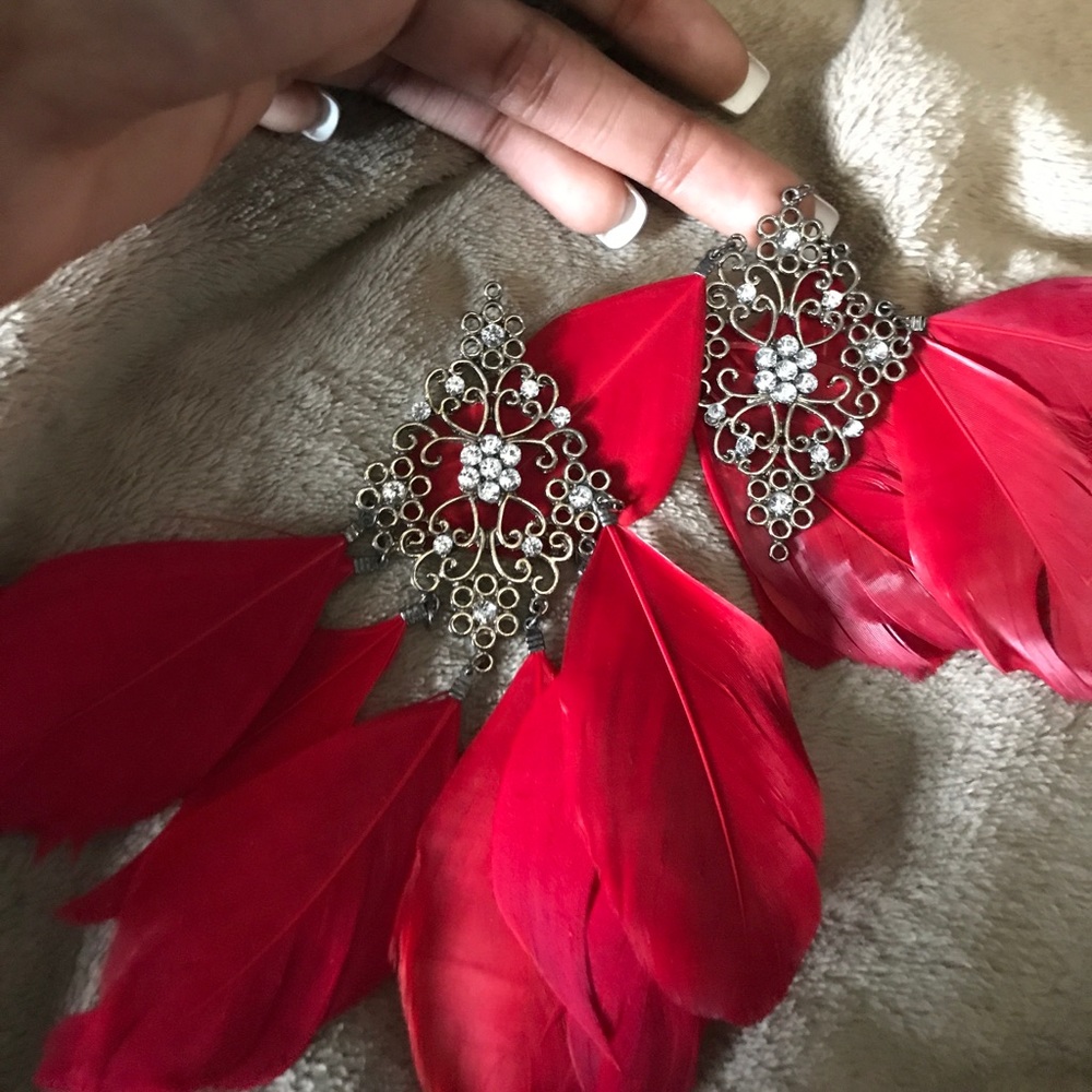 Red feather earrings