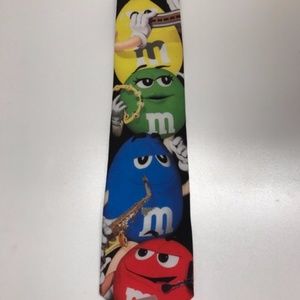 A necktie with M&M's on the front