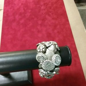 Silver button bracelet.