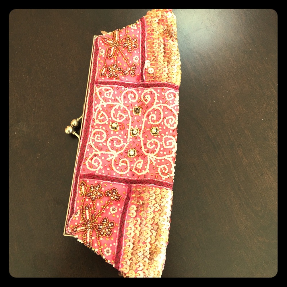 Pink studded clutch