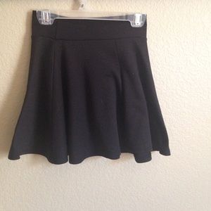 Plain black girls skater skirt.