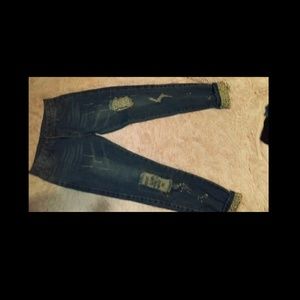 Jeans with rips and bleach splatter