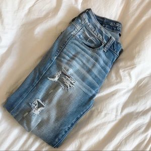 distressed light wash skinny jeans: size 0