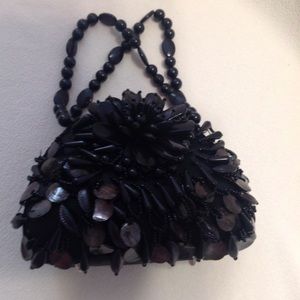 Expressions NYC, rounded beaded, magnetic clutch