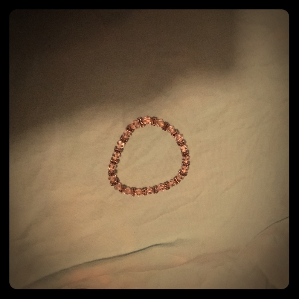 A bracelet with pink  jewels and Silver squares!