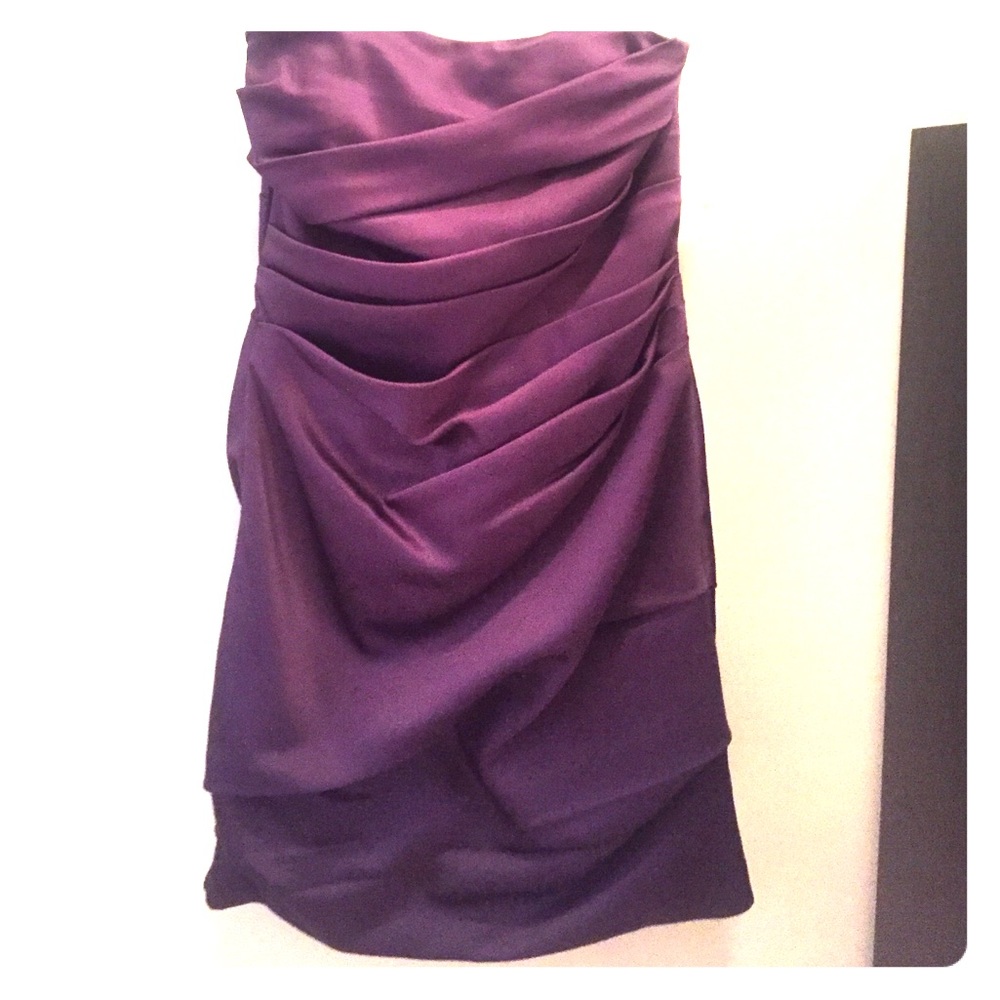A strapless David's Bridal dress in dark purple.