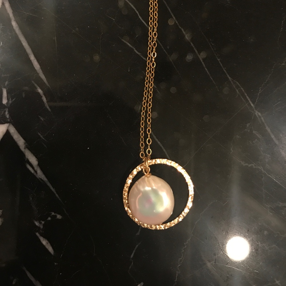 Mother of pearl necklace on gold chain