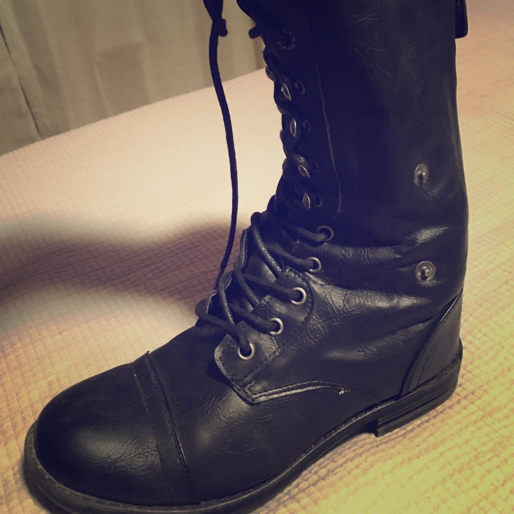 Black combat boots with blue accents