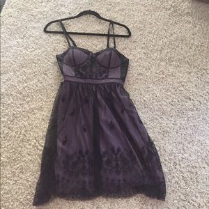 Purple polyester lining with black decorated lace