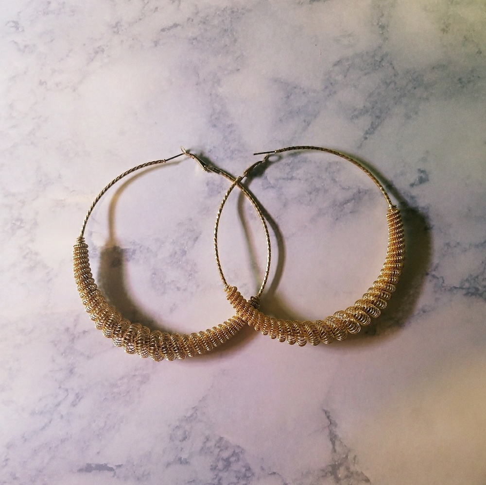 Giant ornate gold hoop earrings