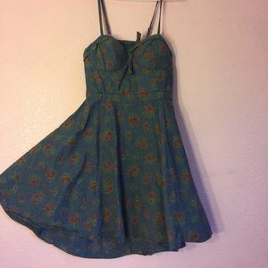 Cute jean dress with open cut in the back.