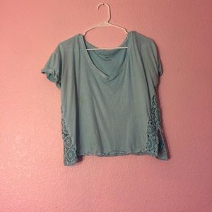 Light blue crop top with lace on the sides