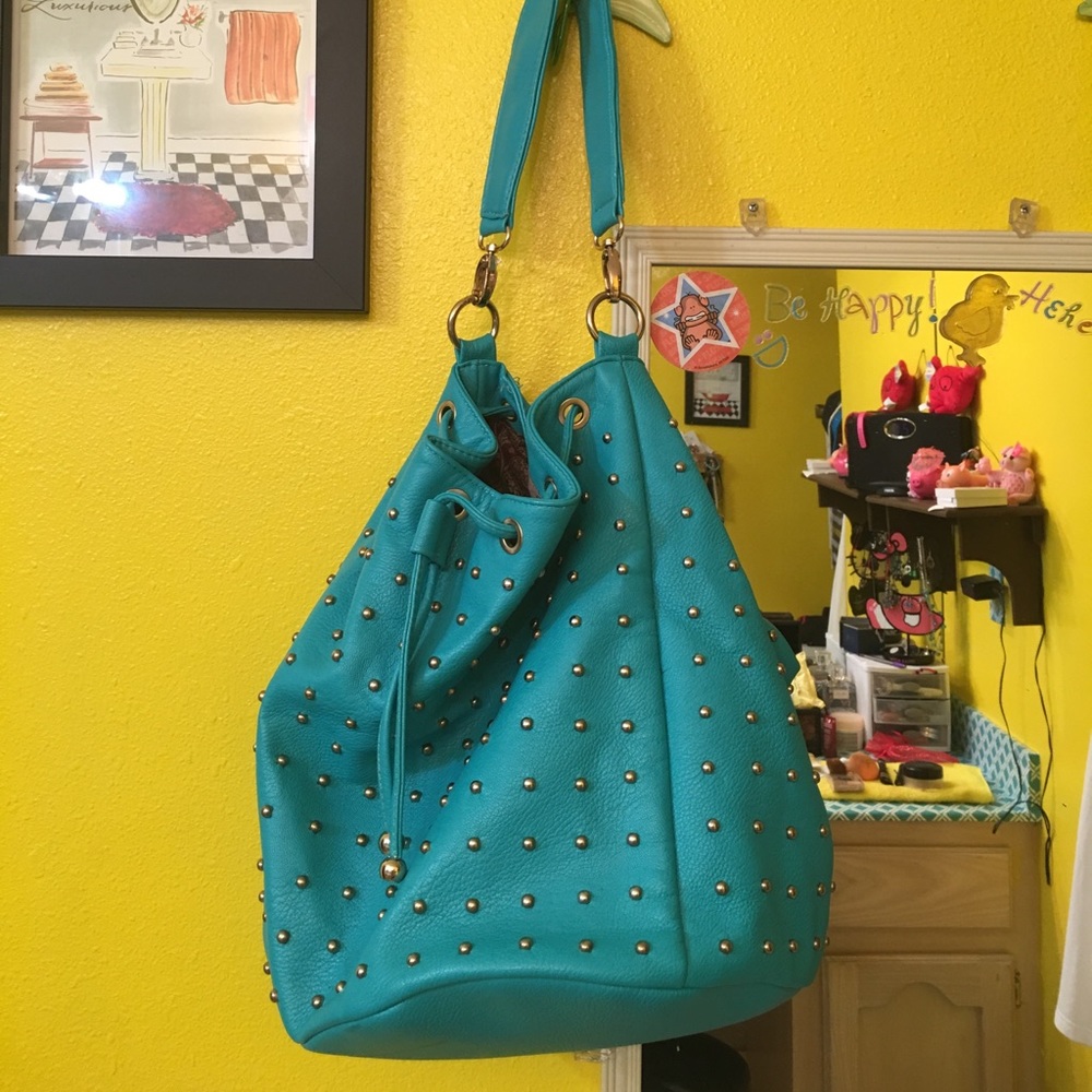 Gold studded turquoise bag